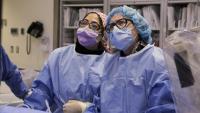 Dr. McEntegart performs a procedure in the cardiac cath lab